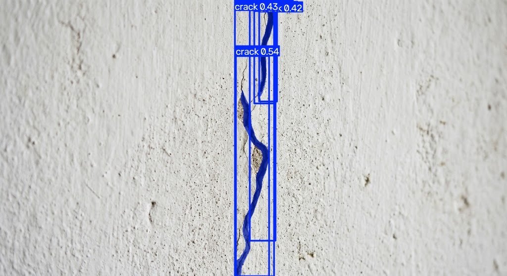 Painted plaster wall with the crack model's output: one crack in three segments, top score 0.54