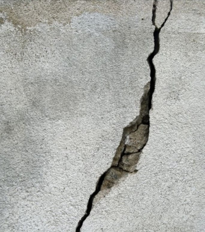 Spalled render on a wall, original photo