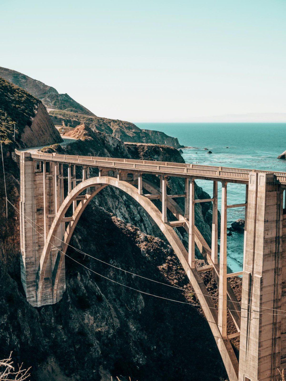 Concrete arch bridge beside the coast